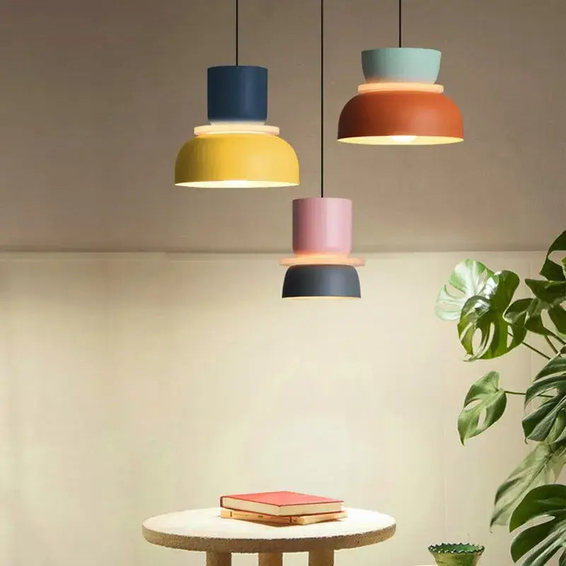 Three modern pendant lamps with stacked colorful shades in navy blue yellow coral orange mint green pink and dark gray by decorbites contemporary led lustre