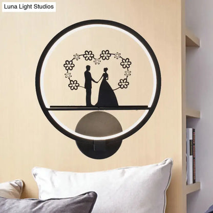 Contemporary lover black circular led wall sconce with couple silhouette and floral design featuring direct wired electric use