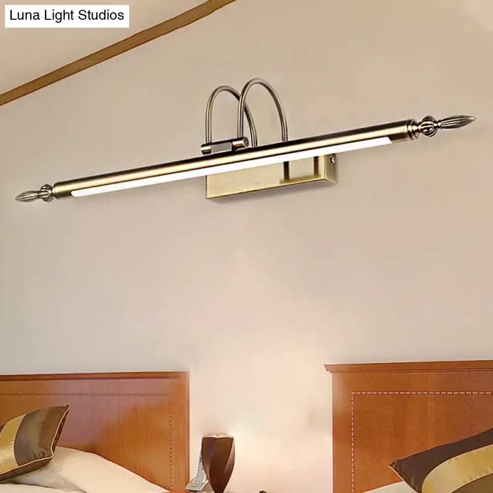 Modern brushed brass wall-mounted vanity light with decorative finials providing warm white nickel finish illumination