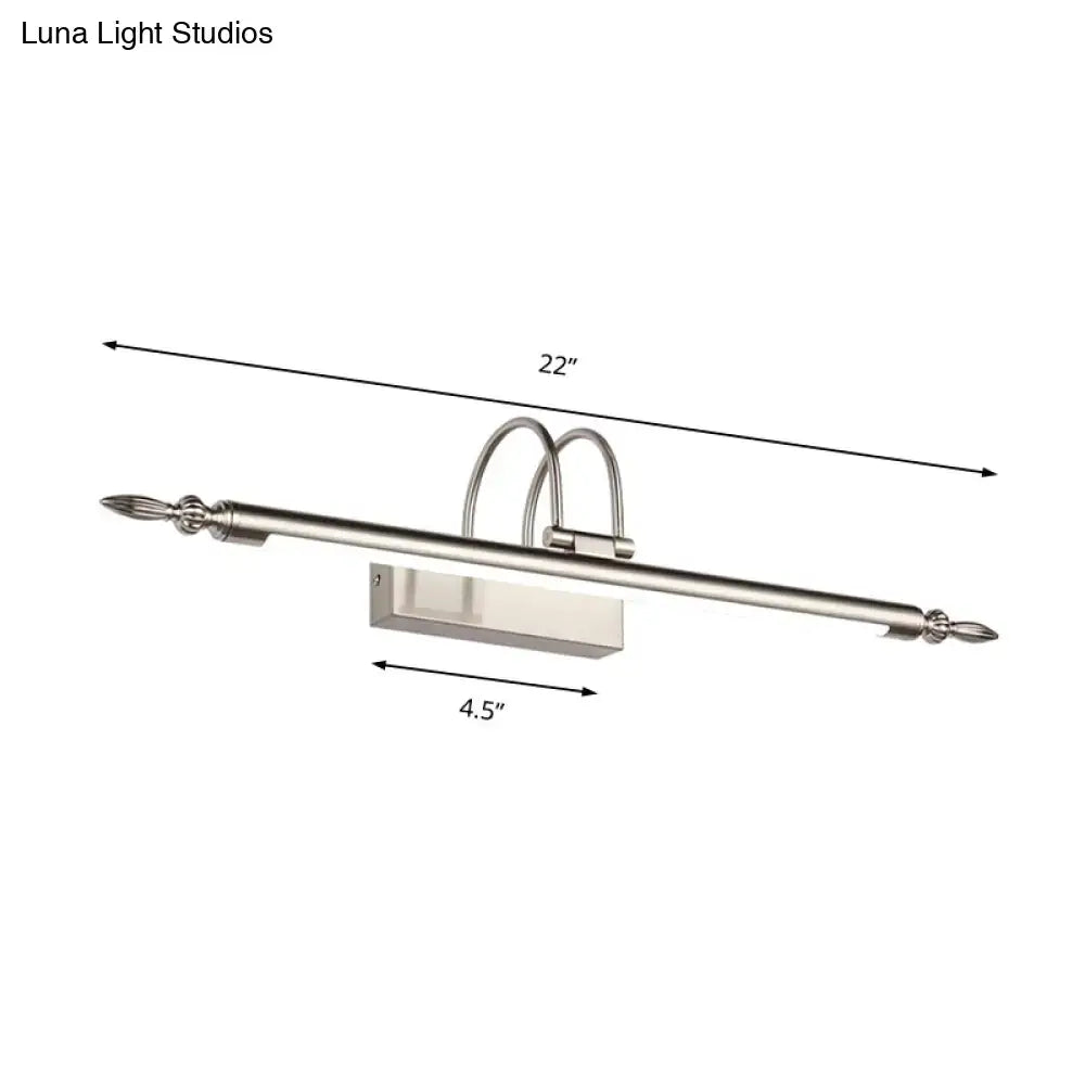 Contemporary 22-inch wall-mounted vanity light with nickel finish, sleek rectangular fixture, curved arms, and warm white light
