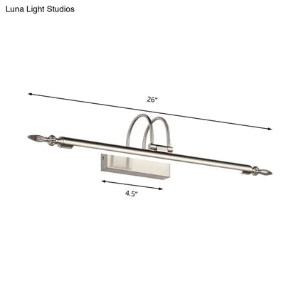 Contemporary nickel finish led wall sconce with silver curved arms and warm light for bedroom use