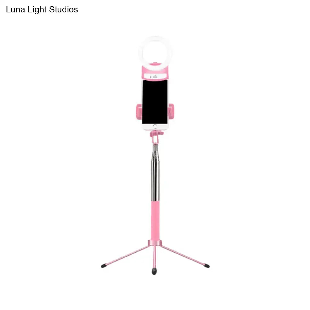 Contemporary pink phone holder with silver telescopic pole and led ring light inch fixture for bedroom use