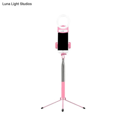 Contemporary pink phone holder with silver telescopic pole and led ring light inch fixture for bedroom use