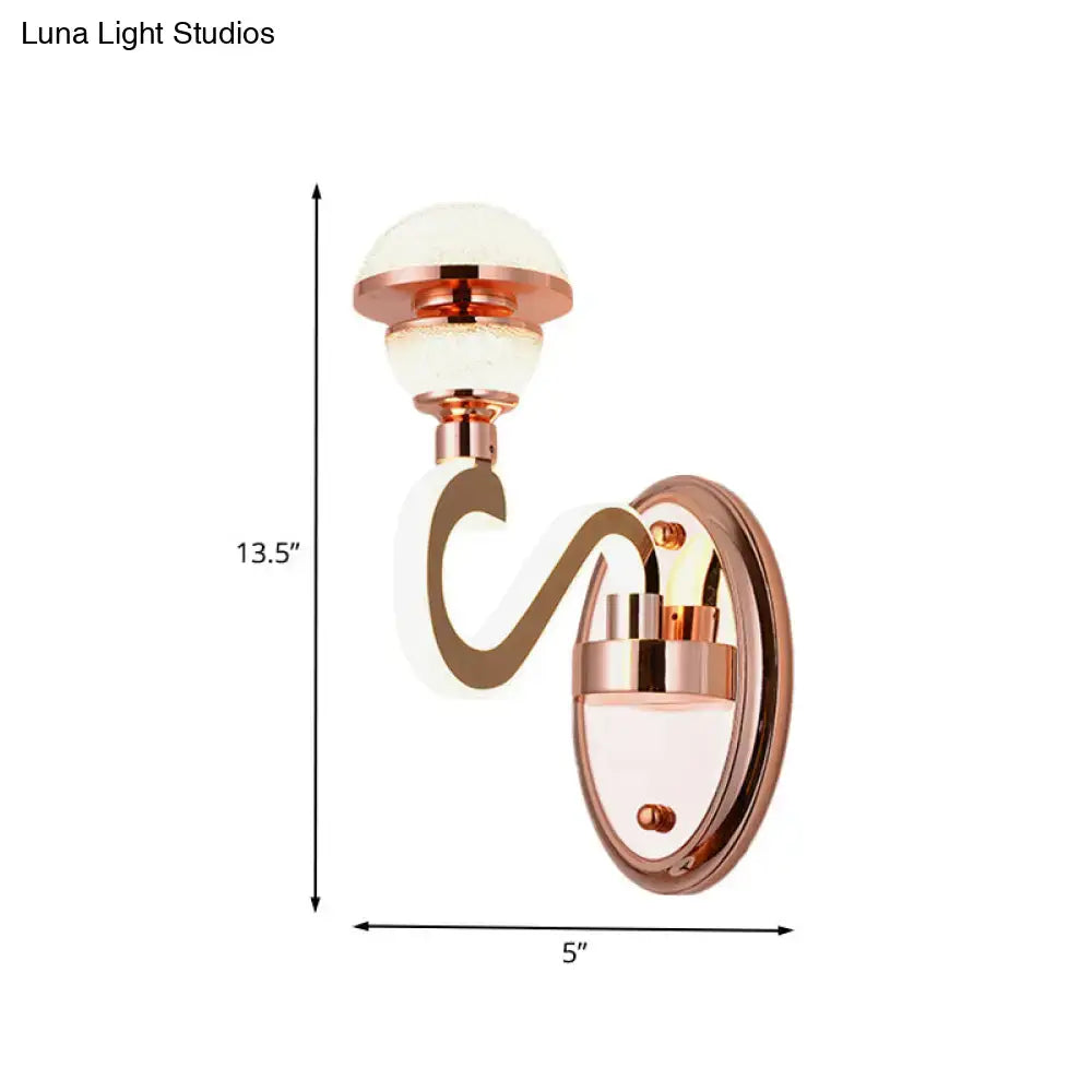Contemporary rose gold metal urn wall lamp with curved s-shaped arm and frosted glass globe shades for bedroom lighting