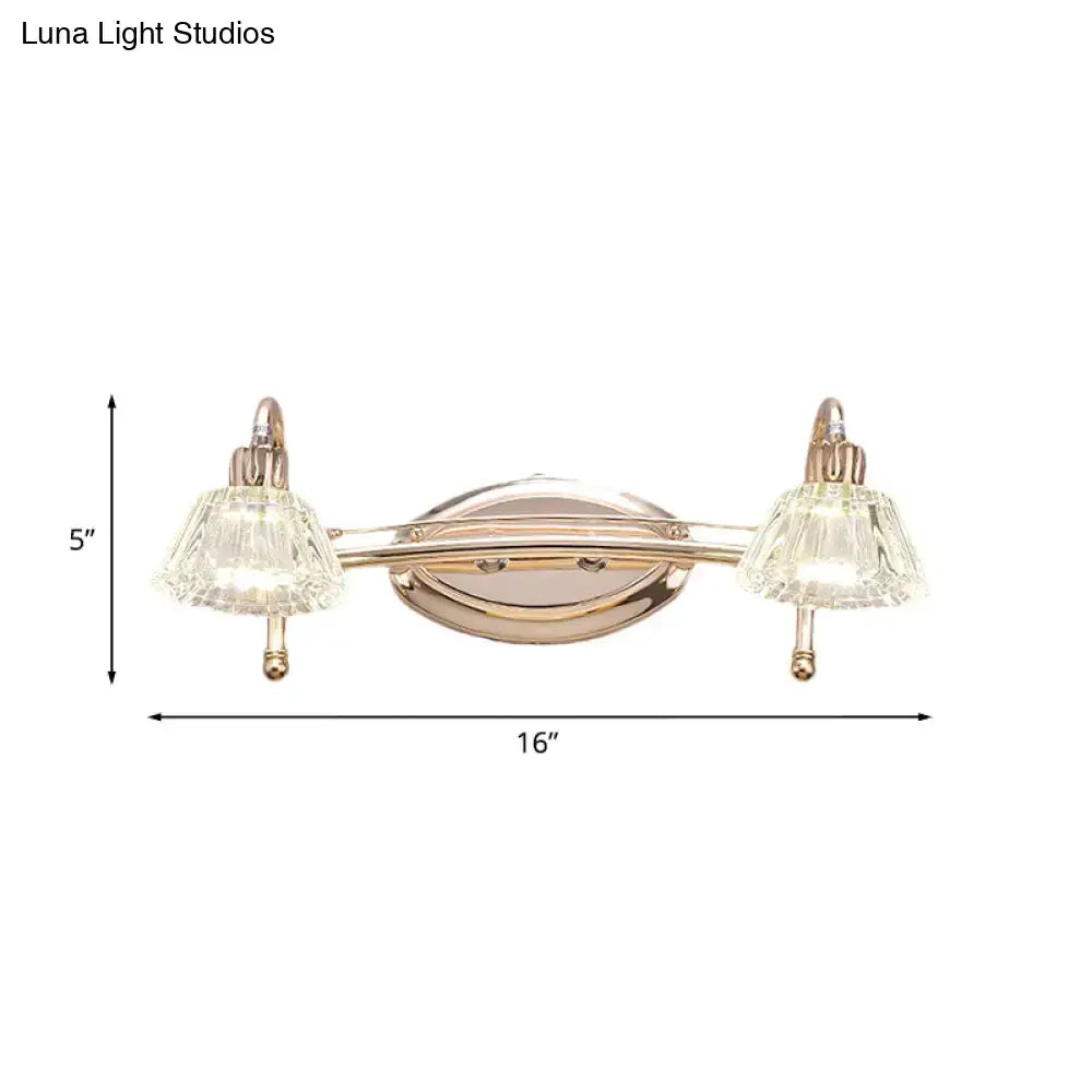 Contemporary rose gold wall vanity light with truncated cone crystal-encrusted glass shades and oval backplate
