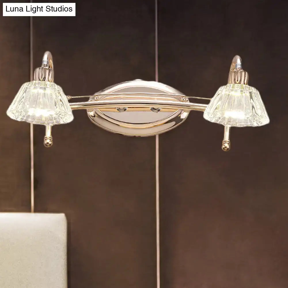 A sleek chrome double-light wall vanity light with truncated cone faceted crystal shades for bathroom use
