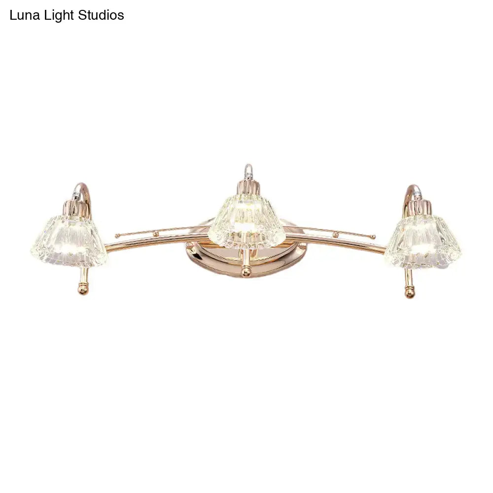 Contemporary rose gold wall vanity light with three truncated cone crystal shades for bathroom use
