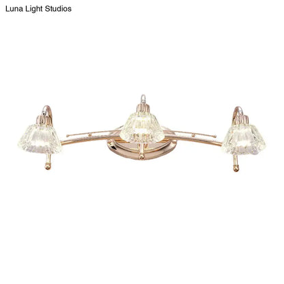 Contemporary rose gold wall vanity light with three truncated cone crystal shades for bathroom use