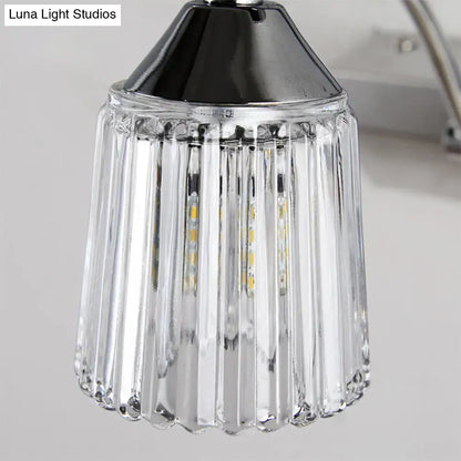 Contemporary silver 3 head crystal vanity light with clear glass pendant wall light featuring vertical ridges and warm white glow