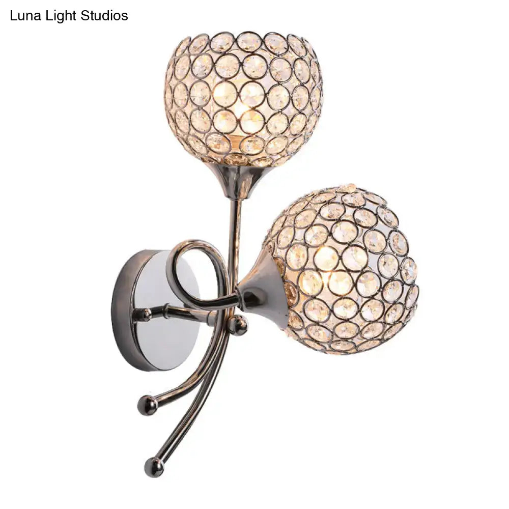 Contemporary silver dual head dome sconce with crystal encrusted spherical shades and polished metallic bulb base light type