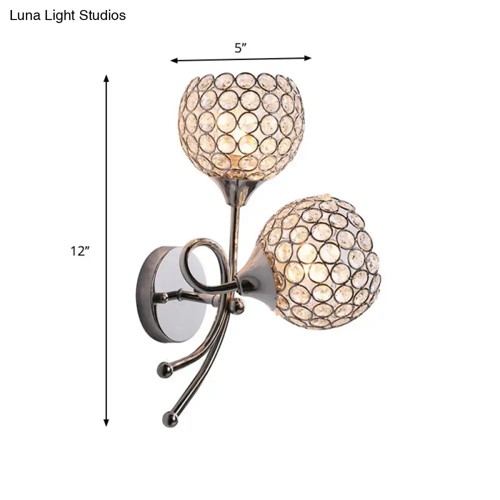 Contemporary silver dual head dome sconce with crystal globe shades featuring circular facet pattern bulb base light type