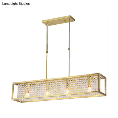 Gold-finished rectangular chandelier with crystal-encrusted frame and three bulbs featuring crystal drops for dining room