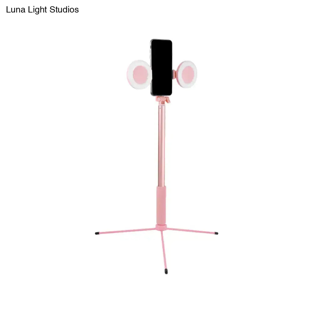 Contemporary style pink selfie stick with two circular led lights and usb port compatible with 110v-120v and 220v-240v