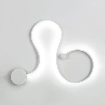 Contemporary twist wall sconce in white with sleek organic curves and warm white light for bedroom use
