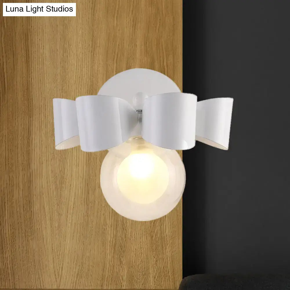 Contemporary white ceramic wall lamp with bow-shaped shade and frosted glass round globe for bedroom use