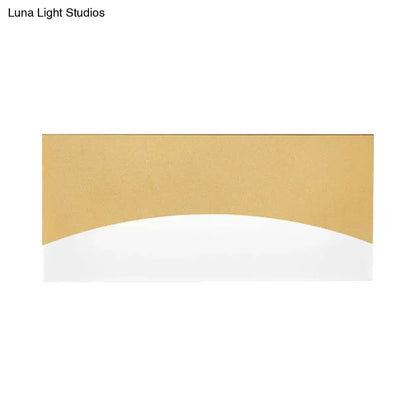 Contemporary white and gold bedroom sconce with brushed gold finish, smooth curved section, warm color temperature, fixture height and width