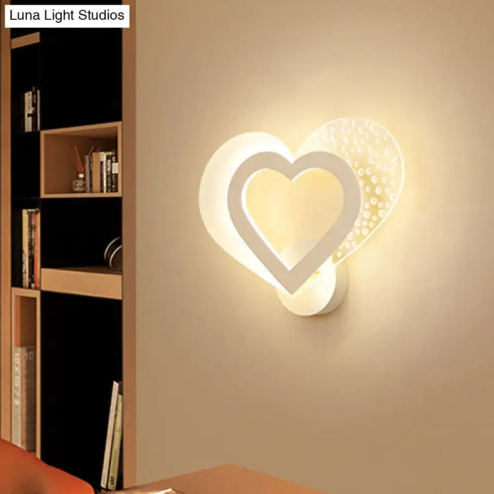 Contemporary white love heart wall mounted light with textured dotted accent panel and soft ambient led lighting