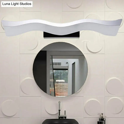 Contemporary white wave led wall mounted light featuring a sleek curved design for modern bathroom use