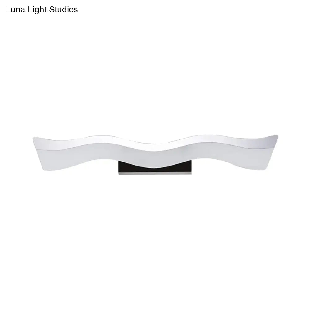Contemporary white wave led wall mounted light with glossy finish and black base as a modern bathroom wall mounted sconce