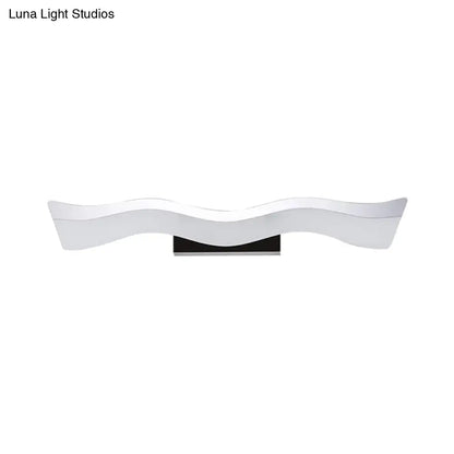 Contemporary white wave led wall mounted light with glossy finish and black base as a modern bathroom wall mounted sconce