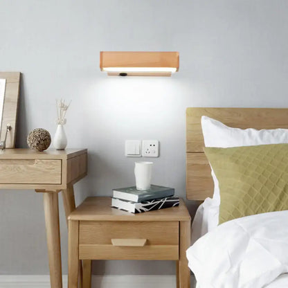 Contemporary wood led wall sconce with acrylic shade featuring a warm wooden finish and integrated led lighting