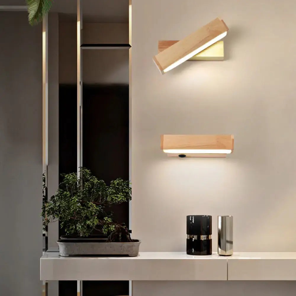 Contemporary wood led wall sconce with acrylic shade featuring natural light wood and sleek metallic accents for corridors
