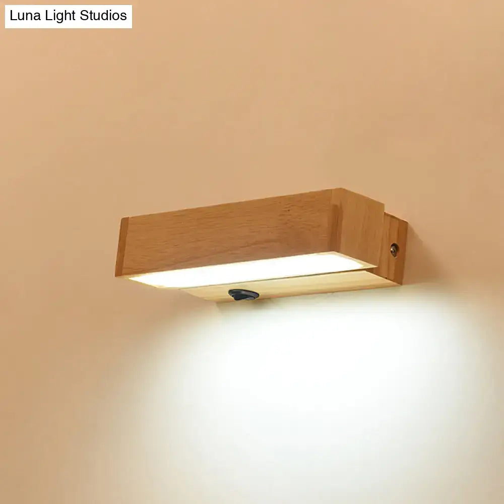 Contemporary wood led wall sconce with acrylic shade featuring a natural wood finish and integrated led illumination