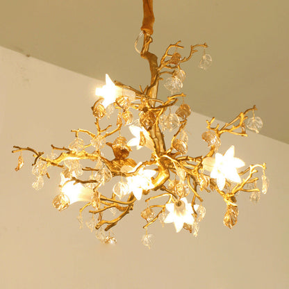 Copper branch chandelier featuring a gold tree branch design with crystal accents and star-shaped lights