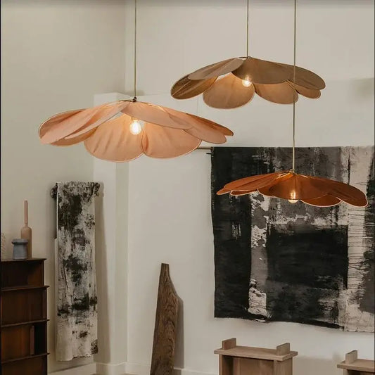 Three copper-toned petal fabric pendant lights from decorbites colorful petal collection for dining room decor