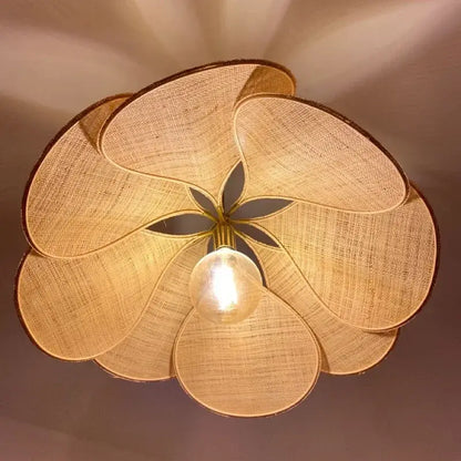 Copper petal fabric pendant light with warm-toned woven floral design featuring central bulb for dining room decorbites colorful petal