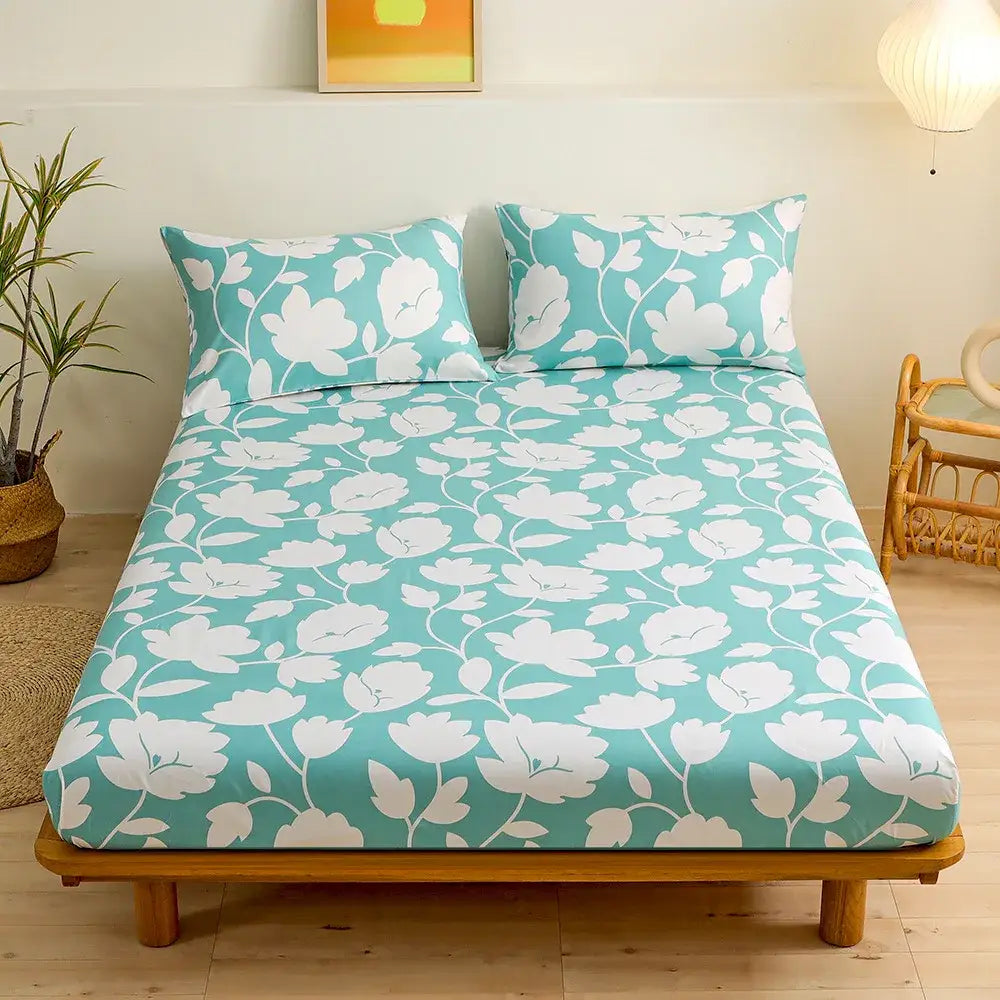 Teal fitted sheet set with white blossoms and vines featuring green leaf flower pattern for bedroom bedding use