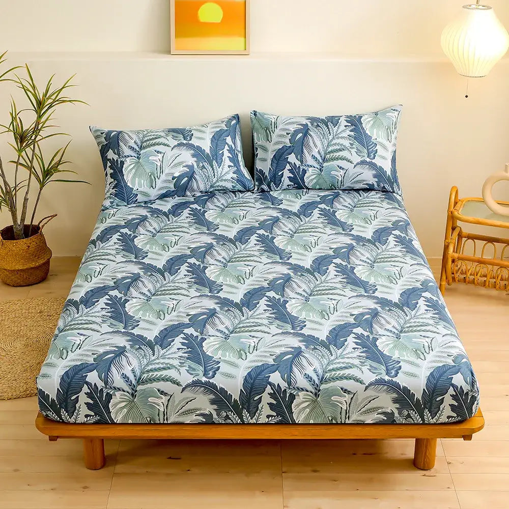 Coral and white geometric floral fitted sheet set with blue and green tropical leaf patterned fitted sheet for bedroom bedding