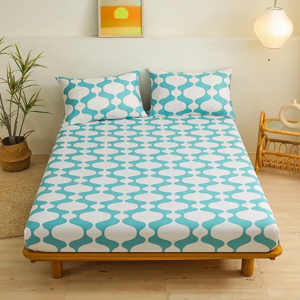 Coral and white geometric floral fitted sheet set with turquoise and white geometric patterned fitted sheet