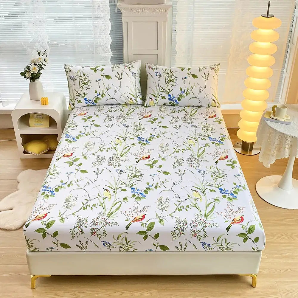White fitted sheet set with coral and white geometric floral design and green leaf flower and small colorful birds