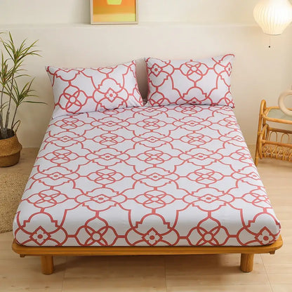 White fitted sheet set with coral red geometric floral pattern featuring interconnected green leaf flower design