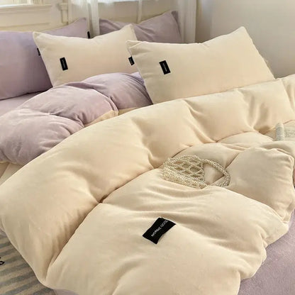 Cream-colored velvet duvet cover set with coral color blocked design and subtle black decorbites coral color brand tag