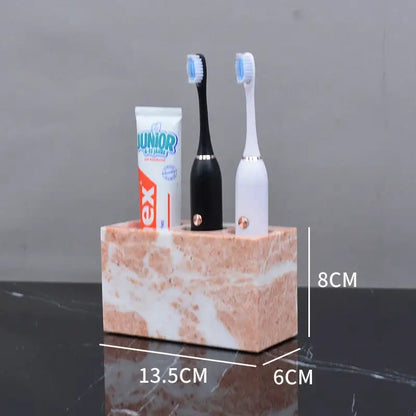 Coral pink marble bathroom toothbrush holder with two slots for electric toothbrushes from decorbites coral pink set