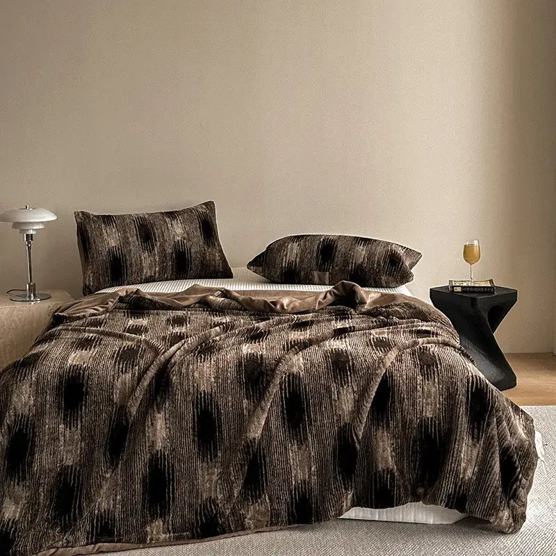 Brown and black ikat-patterned velvet throw blanket with faux rabbit plush texture for decorbites cosy faux living room decor