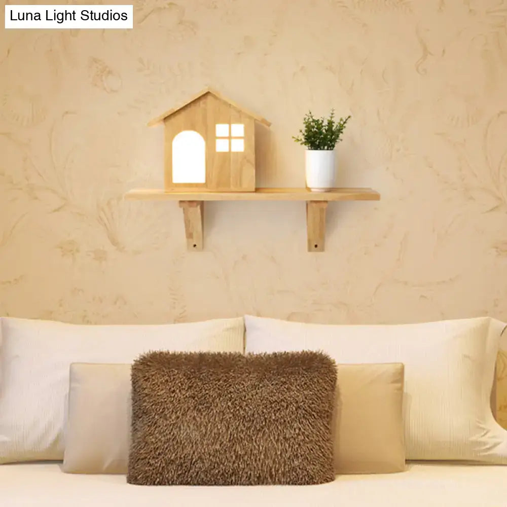 Cottage wood house wall sconce with shelf featuring a warm-toned wooden design and glowing arched doorway and window