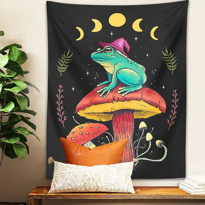 Cottagecore frog on mushroom tapestry wall hanging featuring a teal decorbites frog on a red and yellow mushroom with moon phases