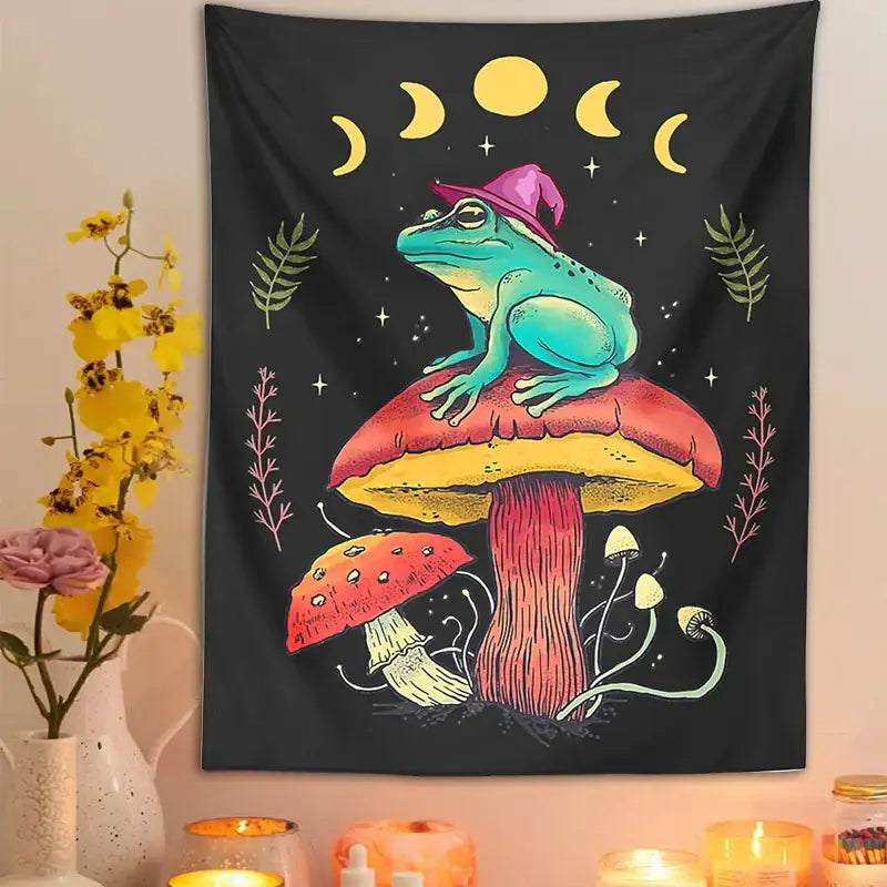 A vibrant teal decorbites frog wearing a purple hat sits on a red and yellow mushroom tapestry wall hanging with moon phases