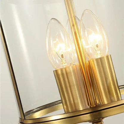 Country bronze glass chandelier lantern with gold-toned metal and clear panels featuring three filament bulbs pendant lights decorbites bronze glass