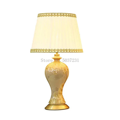 Elegant cream-colored country ceramic table lamp with gold accents and lace-trimmed shade for decorbites bedroom decor
