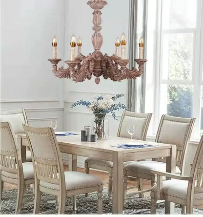 Country french solid wood chandelier with ornate carved wooden arms and soft pinkish brown finish for dining room decorbites country french