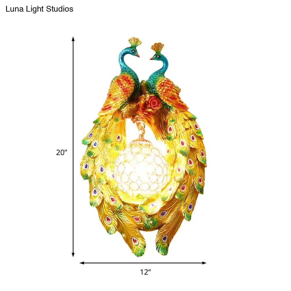 Country gold peacock wall sconce with iridescent gold and teal feathers featuring red and green eye spots for bedroom lighting