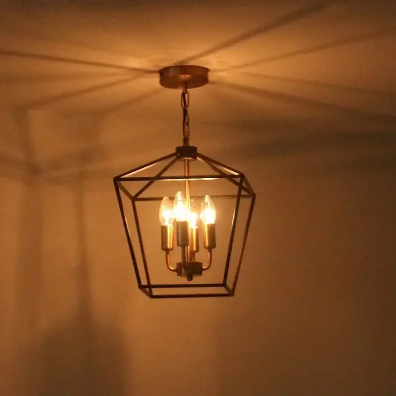 A warm-toned brass geometric chandelier with pentagonal frame and five filament bulbs for decorbites country style iron led decor