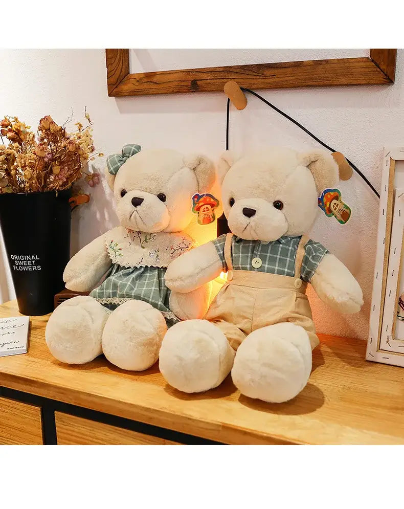 Cream-colored plush couple bear toys dressed in green and white plaid outfits with lace details for christmas gift