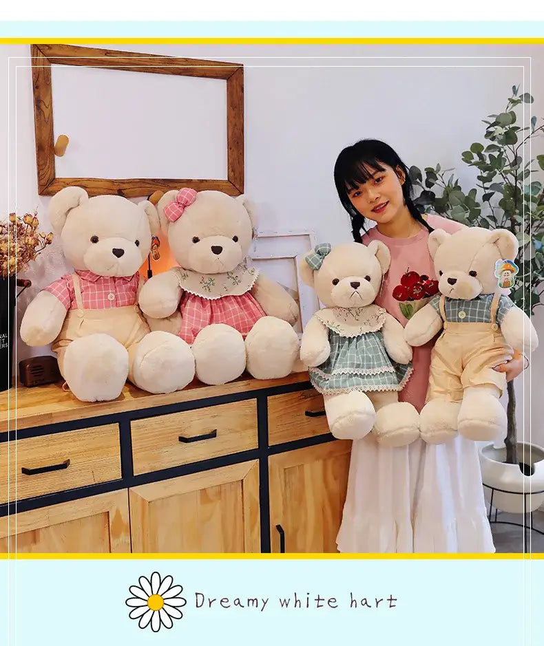 Four cream-colored plush toys featuring couple bear plush dressed in pink and green plaid outfits for christmas gift