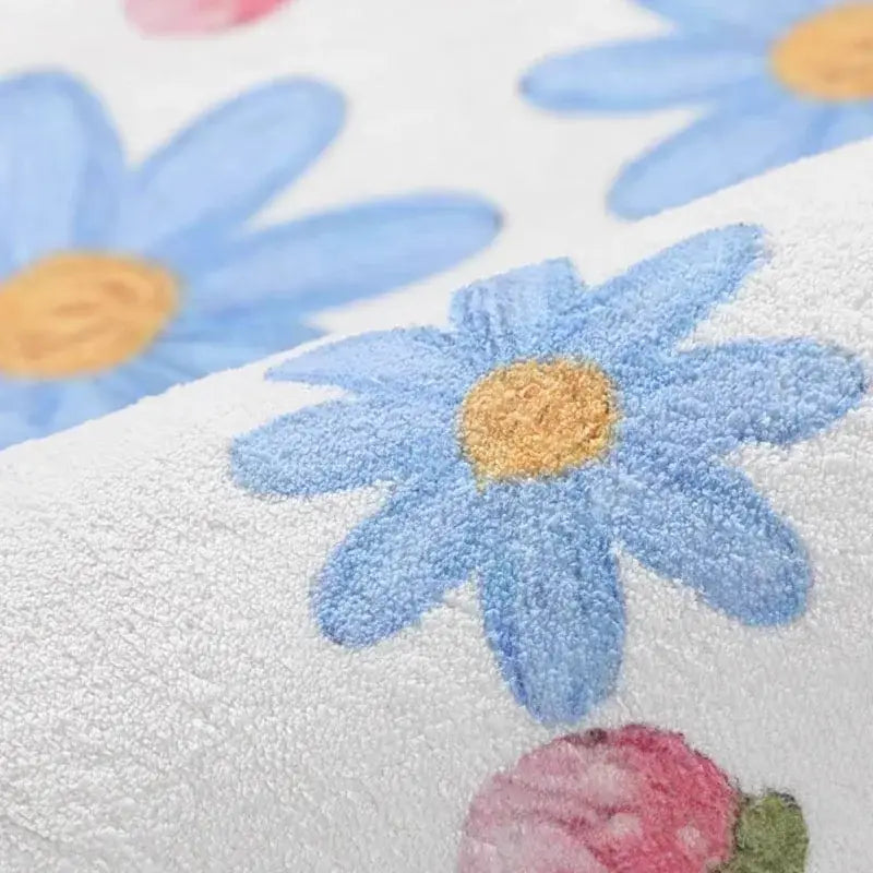 Cozy carpet white bedroom rug with plush texture and embroidered light blue daisies featuring cartoon ball print decorbites