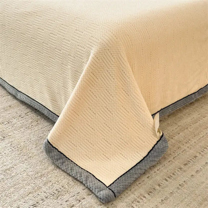 Beige textured bedspread with gray plush border and subtle woven pattern for decorbites cozy carved velvet throw